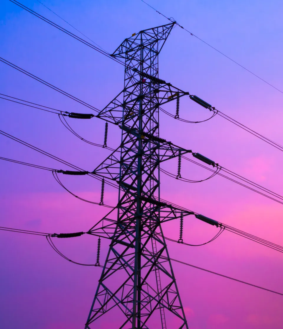 Power lines against sunset