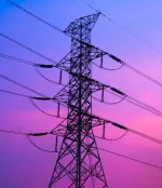 Power lines against sunset