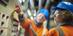 Two power station employees working