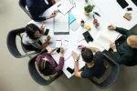 People sitting around a table and working