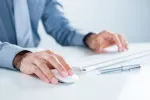 Hands using keyboard and mouse