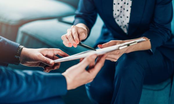 2 people looking at a form