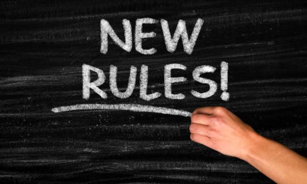Blackboard with the words 'New Rules' written in chalk