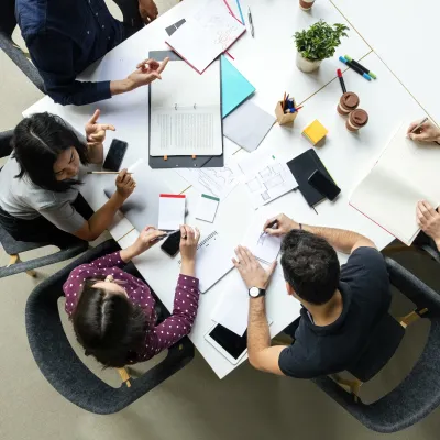 People sitting around a table and working