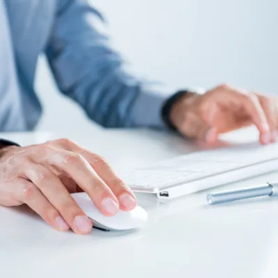 Hands using keyboard and mouse